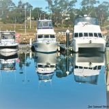Boats with a reflection at the Triabunna Marina. Photo: Joe, aged 15.